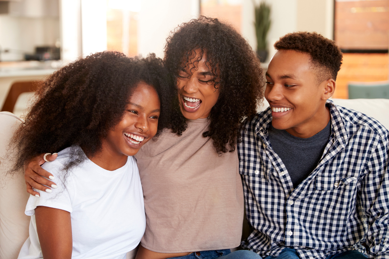 Black Teen and Young Adult Brother and Sisters Relaxing Together